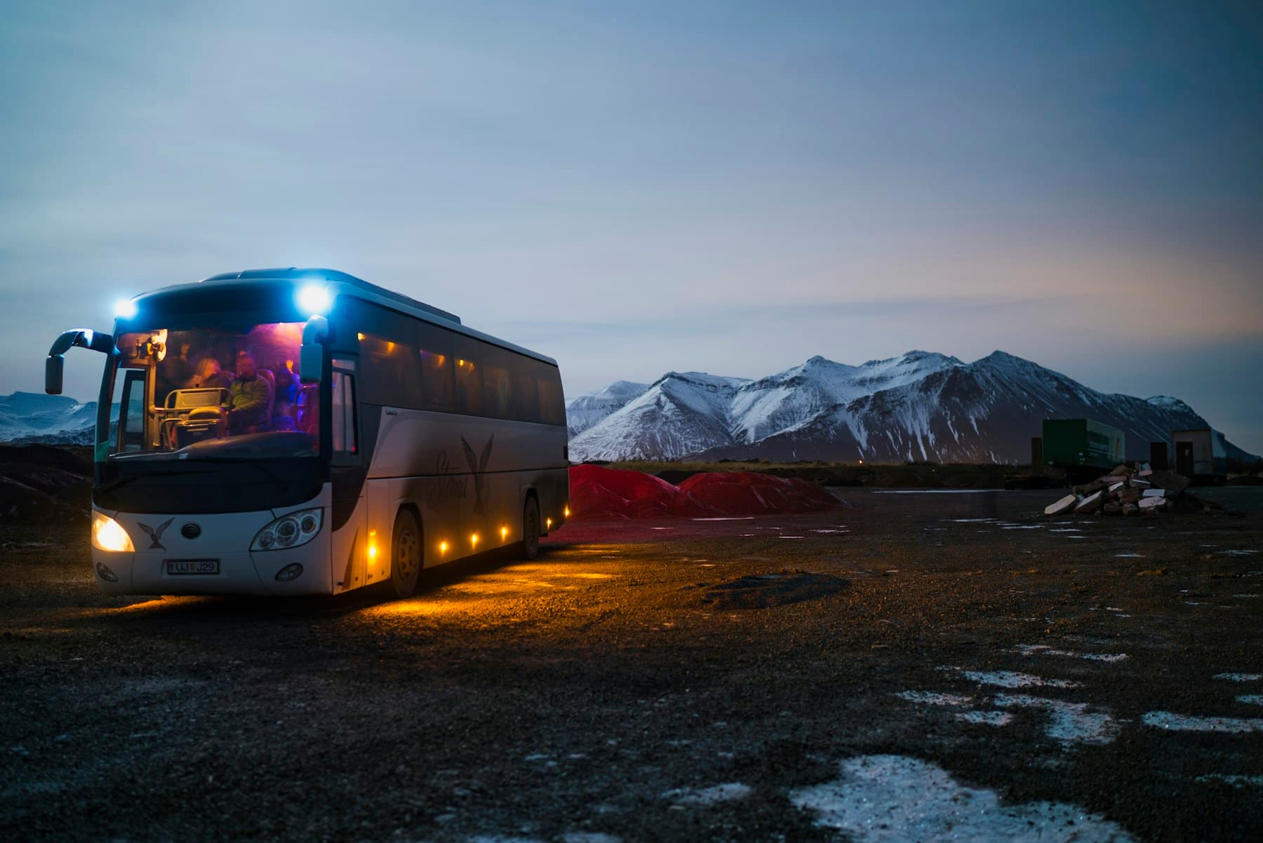Tour coach at a mountain destination, shown as a group-transport demo image